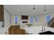 Open concept living room with white trim, hardwood floors, fireplace and staircase at 2603 Vineyard St, Durham, NC 27707