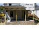 New porch featuring brick foundation, support columns, and a roof, providing a covered outdoor space at 2603 Vineyard St, Durham, NC 27707