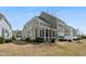 Backyard featuring a screened-in porch attached to the house with sparse grass and a blue sky at 310 Shale Creek Dr, Durham, NC 27703