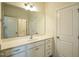 Bright bathroom featuring tile flooring, a single vanity, and a door leading to the Primary bedroom at 310 Shale Creek Dr, Durham, NC 27703