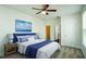 Bright bedroom with neutral paint, ceiling fan, carpet, and ensuite bathroom at 310 Shale Creek Dr, Durham, NC 27703
