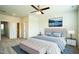 This serene bedroom is complete with an accent rug, a ceiling fan, and comforting natural light at 310 Shale Creek Dr, Durham, NC 27703