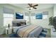 Well-furnished primary bedroom with a ceiling fan and two wave-themed prints on the wall at 310 Shale Creek Dr, Durham, NC 27703