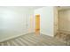 Neutral bedroom with carpet floors and a white door at 310 Shale Creek Dr, Durham, NC 27703