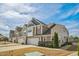 These townhomes showcase a neutral palette, a two-car garage, and manicured lawns at 310 Shale Creek Dr, Durham, NC 27703