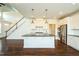 Spacious kitchen open to the living area, featuring a large center island and stainless appliances at 310 Shale Creek Dr, Durham, NC 27703