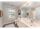 Bright bathroom with a large mirror, vanity, and decor at 318 Sylvias Ct, Durham, NC 27703