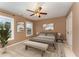 This bedroom features neutral carpet, two windows for natural light, and is furnished with art and decor at 318 Sylvias Ct, Durham, NC 27703