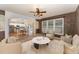 Tastefully furnished living room with kitchen view, plush seating, and stylish accents at 318 Sylvias Ct, Durham, NC 27703
