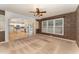 Inviting living room features neutral decor, large window and arched entryway to the kitchen at 318 Sylvias Ct, Durham, NC 27703