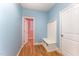 Light and airy mudroom with built-in bench and coat hooks, providing convenient storage at 318 Sylvias Ct, Durham, NC 27703