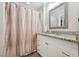 Bathroom featuring granite countertops, modern vanity, and shower with curtain at 327F Bobbitt Rd, Clayton, NC 27520
