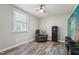 Bedroom with a comfortable sitting area, a window for natural light and wood-style flooring at 327F Bobbitt Rd, Clayton, NC 27520