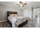 Comfortable bedroom with ceiling fan, natural light, and wood-style flooring at 327F Bobbitt Rd, Clayton, NC 27520