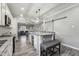 Bright, eat-in kitchen boasts granite countertops, stainless steel appliances, and an island with seating at 327F Bobbitt Rd, Clayton, NC 27520