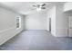 Spacious bedroom featuring neutral tones, a ceiling fan, and natural light from the window at 350 Gilman Ln # 104, Raleigh, NC 27610