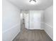 Gray bedroom with carpet flooring, white walls, and a stairway visible through the doorway at 350 Gilman Ln # 104, Raleigh, NC 27610