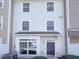 Traditional two-story townhome featuring a charming entrance and symmetrical window design at 350 Gilman Ln # 104, Raleigh, NC 27610