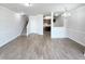 Open floor plan with views of the living room, stairs, and kitchen at 350 Gilman Ln # 104, Raleigh, NC 27610