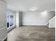 Open-concept living room with modern lighting and hardwood flooring, filled with natural light at 350 Gilman Ln # 104, Raleigh, NC 27610