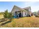 Backyard and patio of a two-story home on a sunny day at 36 Labradoodle Ct, Garner, NC 27529