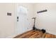 Entryway with coat rack and scooter, featuring stylish wood-look flooring and a bright white door at 36 Labradoodle Ct, Garner, NC 27529