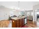 Open concept kitchen features a center island and flows into the living and dining areas at 36 Labradoodle Ct, Garner, NC 27529