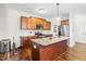 Modern kitchen with stainless steel appliances, granite countertops, and a center island with a sink at 36 Labradoodle Ct, Garner, NC 27529