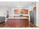 Modern kitchen with granite countertops, stainless steel appliances, and a center island with a sink at 36 Labradoodle Ct, Garner, NC 27529