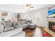 Bright living room features a fireplace and open layout with view into kitchen and dining area at 36 Labradoodle Ct, Garner, NC 27529