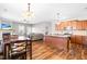 Open-concept living and kitchen area with hardwood floors and a modern design at 36 Labradoodle Ct, Garner, NC 27529