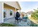 Covered patio with outdoor seating and grill for entertaining or relaxing at 36 Labradoodle Ct, Garner, NC 27529