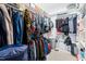 Spacious walk-in closet featuring ample shelving and hanging storage for organization at 36 Labradoodle Ct, Garner, NC 27529