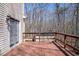 Wooden back deck provides views of the trees and backyard at 401 Joyce Rd, Hillsborough, NC 27278