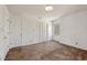 Bright bedroom with neutral walls and carpet, offering space for personalization and storage at 401 Joyce Rd, Hillsborough, NC 27278