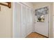Bright entryway with storage closet and door with window letting in natural light at 401 Joyce Rd, Hillsborough, NC 27278