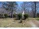 Exterior view of a home with mature trees surrounding the property at 401 Joyce Rd, Hillsborough, NC 27278
