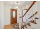 Inviting foyer with hardwood floors, a wooden staircase, and an ornate front door at 401 Joyce Rd, Hillsborough, NC 27278