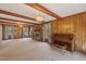 Bright living room featuring a brick fireplace, wood accents, and large windows at 401 Joyce Rd, Hillsborough, NC 27278