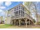 Expansive wooden deck and screened in porch offer ample outdoor entertaining space at 401 Molina Ct, Rolesville, NC 27571