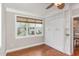 Bedroom with built-in Murphy bed, shelving and large window with a view at 401 Molina Ct, Rolesville, NC 27571