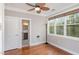 Bright bedroom features hardwood floors, large windows, and ensuite bathroom at 401 Molina Ct, Rolesville, NC 27571