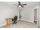 Bright bedroom featuring neutral paint, ceiling fan, carpeted floors, a desk and a white bookshelf at 401 Molina Ct, Rolesville, NC 27571
