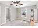 A brightly lit bedroom featuring a closet and a study nook at 401 Molina Ct, Rolesville, NC 27571