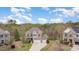 Stunning two-story brick home featuring a three-car garage and manicured landscaping at 401 Molina Ct, Rolesville, NC 27571