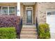 Inviting front entrance with brick steps and manicured landscaping at 401 Molina Ct, Rolesville, NC 27571