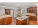 Spacious kitchen features granite counters, wood floors, stainless appliances, and breakfast nook at 401 Molina Ct, Rolesville, NC 27571