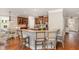 Open-concept kitchen with granite countertops, stainless steel appliances, and a breakfast bar at 401 Molina Ct, Rolesville, NC 27571