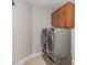 Laundry room equipped with a modern washer and dryer and ample storage at 401 Molina Ct, Rolesville, NC 27571