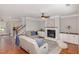 Cozy living room with a fireplace, built-in shelving and plush seating at 401 Molina Ct, Rolesville, NC 27571
